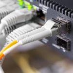 close up of high speed fiber network switch and cable scaled 1